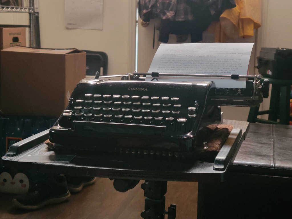 Black Corona typewriter with a typed page